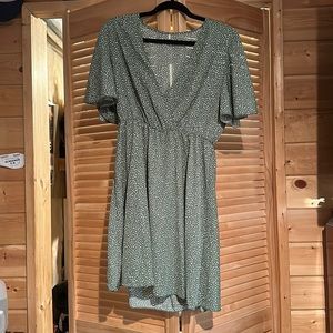 Green and white polka dotted dress